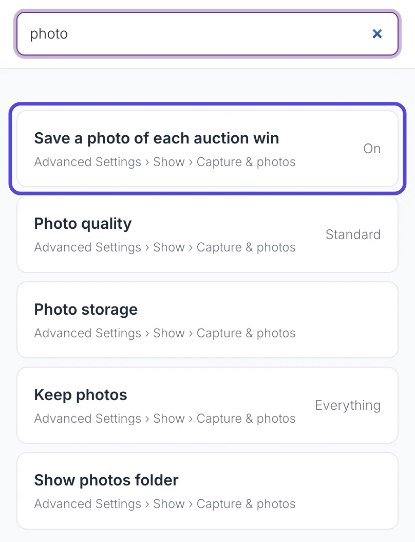 The Settings panel with photo typed in its search box and a list of matching settings, each with Advanced Settings and its page. Save a photo of each auction win is circled.